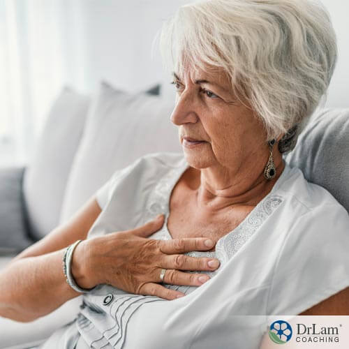 An image of an older woman suffering from functional dyspepsia