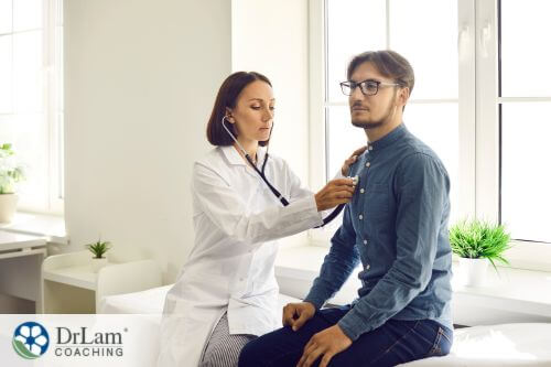 An image of a man having his respiratory health checked by his doctor