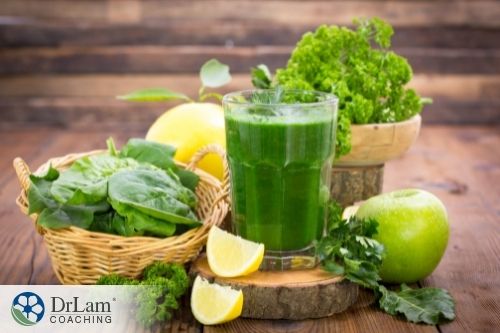 An image of a green smoothie and its ingredients