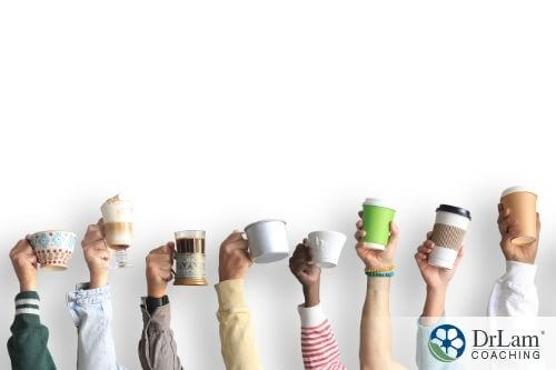 An image of people raising up different cups of coffee