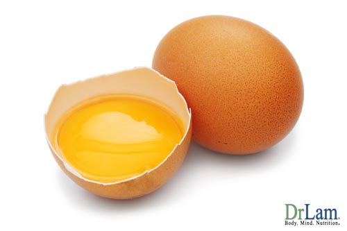 Two brown eggs, one of them cracked in half to reveal the liquid yolk resting in a half shell. The quality of protein in an egg is another of the health benefits of eggs.