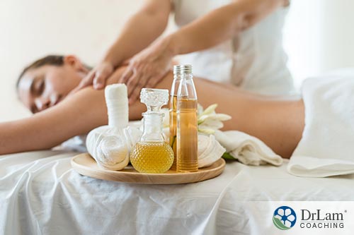 an image of a woman having massage and feeling relaxed in spa