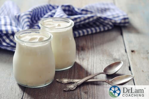 An image of two yogurt jars with spoons