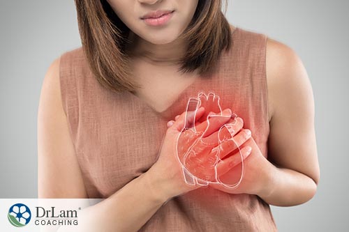 An image of a woman holding her heart