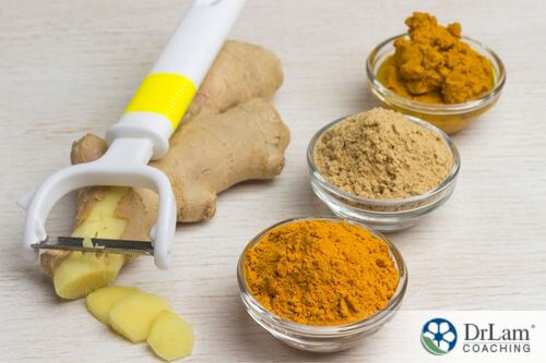 An image of fresh ginger root and powdered tumeric and ginger