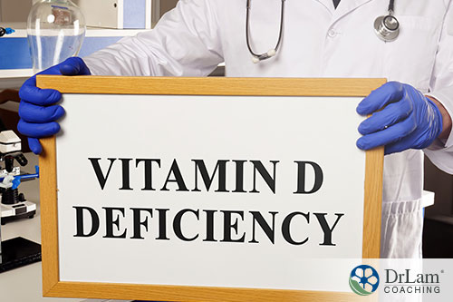 image of a doctor holding a sign of the word vit. d deficiency