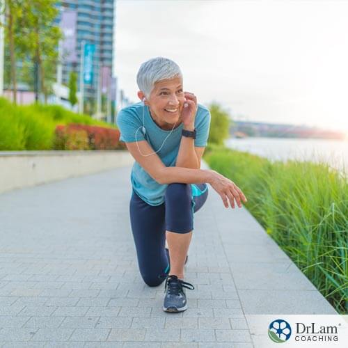 An image of an older woman who is enjoying some high intensity interval training along a river's walking path