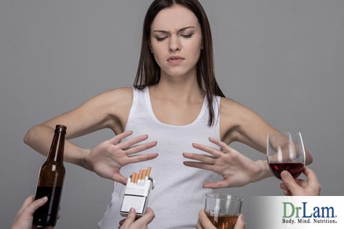 A young woman refusing alcohol and nicotene, one step in how to cleanse the liver.
