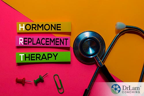 An image of the words hormone replacement therapy with a stethoscope and paperclip by them