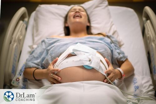 An image of a woam in pain while she is in labor