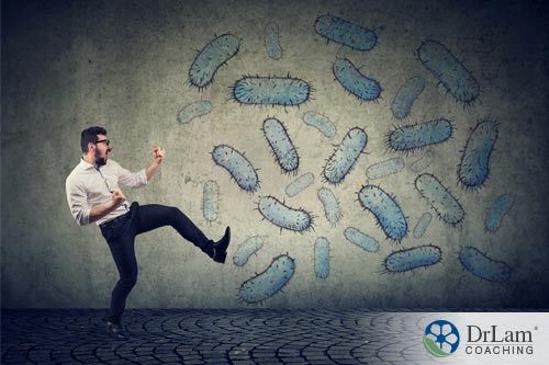 An image of a man fighting a cloud of germs