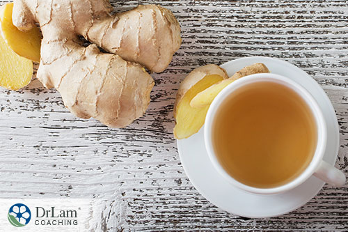 An image of a cup of ginger tea with fresh ginger root