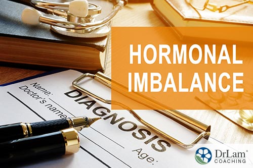 An image of a clipboard with pens and the words hormonal imbalance above it