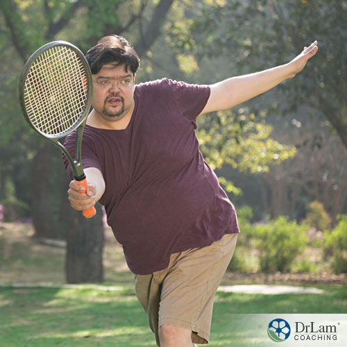 An image of an obese man playing tennis to increase testosterone naturally