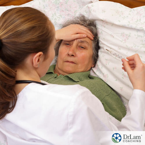 An image of a sick older woman in bed fighting an infection