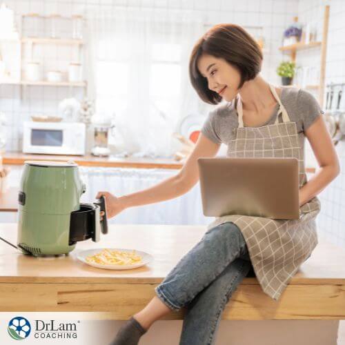 An image of a woman cooking with an Air Fryer