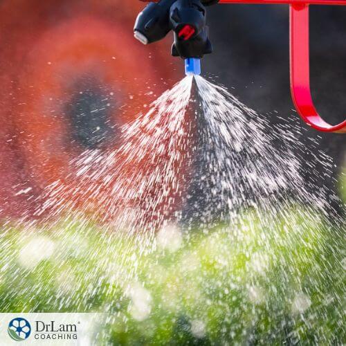 An image of fertilizer spraying out of a nozzle
