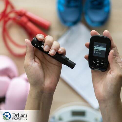 An image of someone testing their blood glucose level