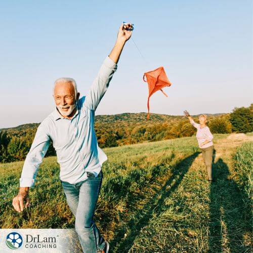 An image of a couple of SuperAgers flying a kite