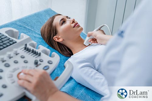 An image of a woman having her thyroid examined