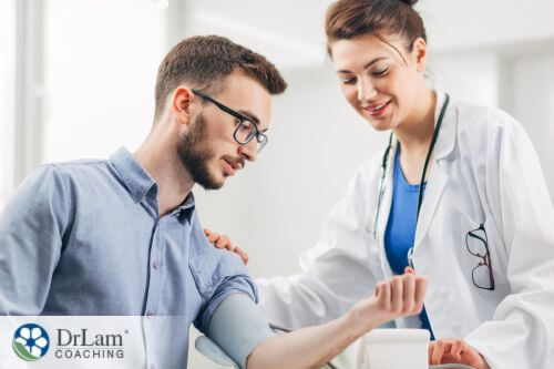 An image of a man showing his doctor something on his arm