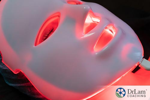 An image of a woman wearing a laser therapy mask