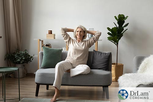 An image of a woman relaxing on her couch
