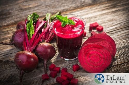 An image of beets and a glass of beet juice