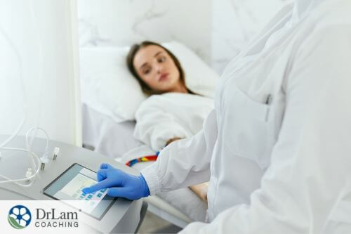 An image of a woman in a hospital bed and a doctor at a EBOO monitor