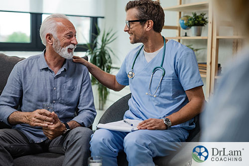An image of an older man talking with a doctor smiling