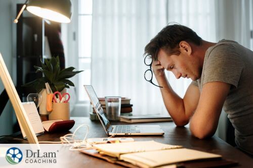 An image of a stressed man at a desk