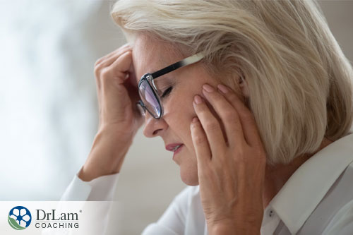 An image of an older woman with a headache