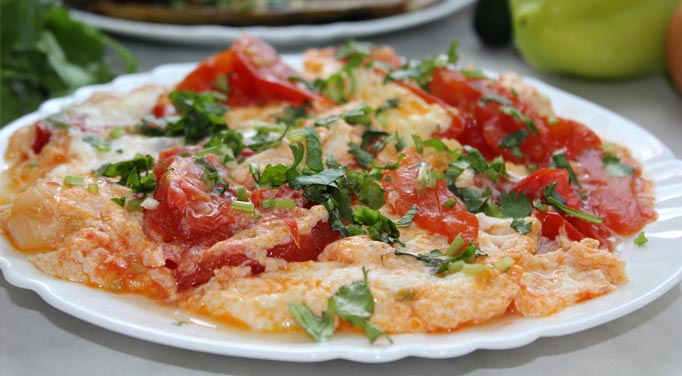 A cooked Tomato Eggs dish. Eggs are incredibly versatile and can be used in many dishes to take advantage of the health benefits of eggs.