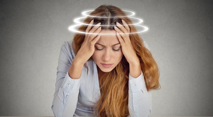 Woman suffering from a spinning head. What causes dizziness for her?
