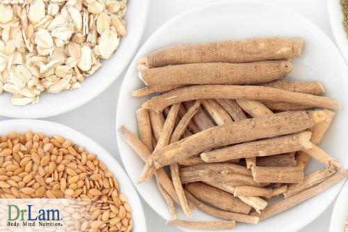 Dried and cut ashwagandha in a bowl next to a bowl of meat and nuts, indicating the benefits of ashwagandha are complementary to a healthy life