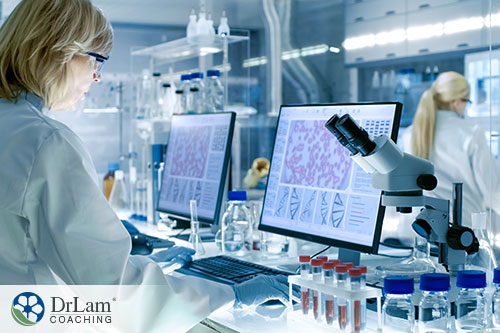 An image of a woman looking at data on a computer in a lab