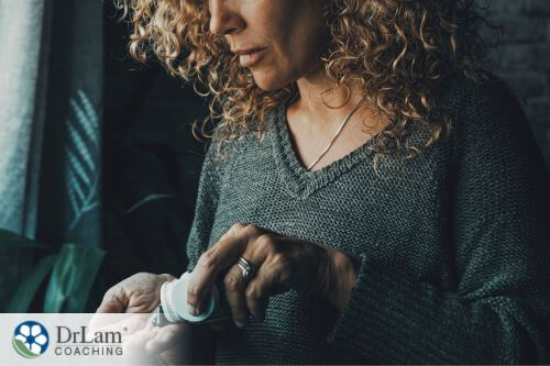 An image of a woman taking supplements