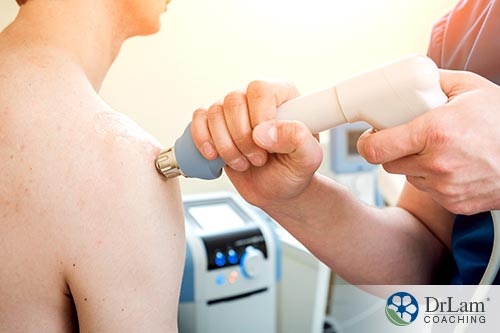 An image of a young man getting millimeter wave therapy on his shoulder socket