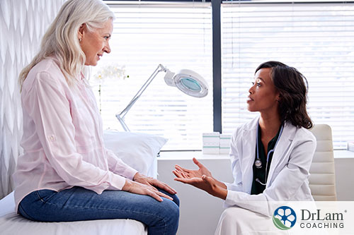 An image of an older woman talking with her doctor