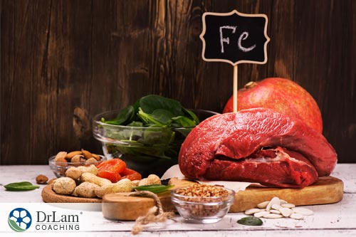 An image of Iron rich foods arranged on cutting board, one of the essential muscle building nutrients