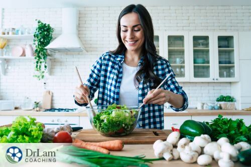 An image of a woman making a salad