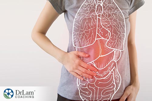 An image of a woman with a image of lungs, liver, and digestive system on her shirt