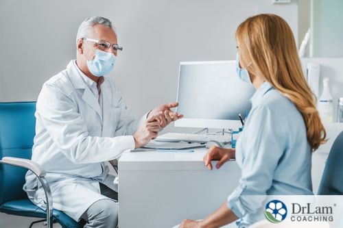 An image of a woman talking with her doctor