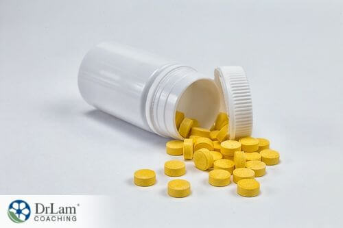 An image of a bottle of yellow tablets