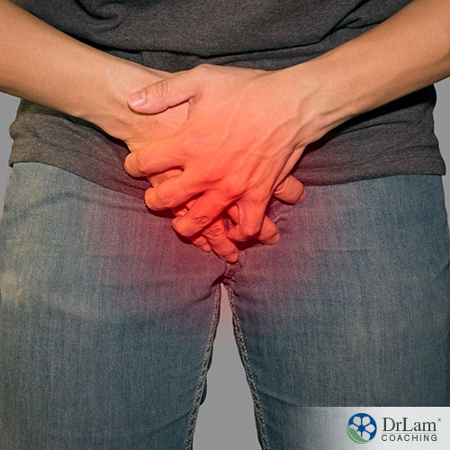 An image of a man holding his groin area