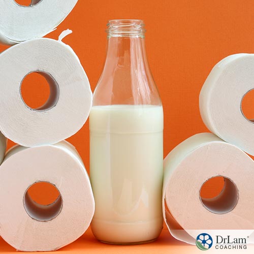 An image of a bottle of milk surrounded by toilet paper