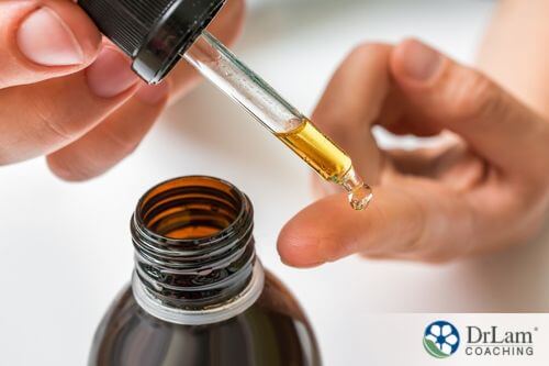An image of someone applying ozonated oil on their finger