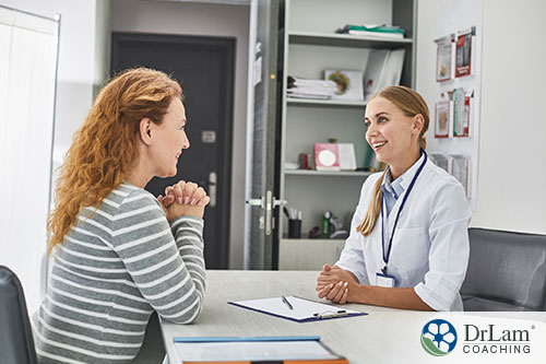 An image of a young woman talking to a doctor