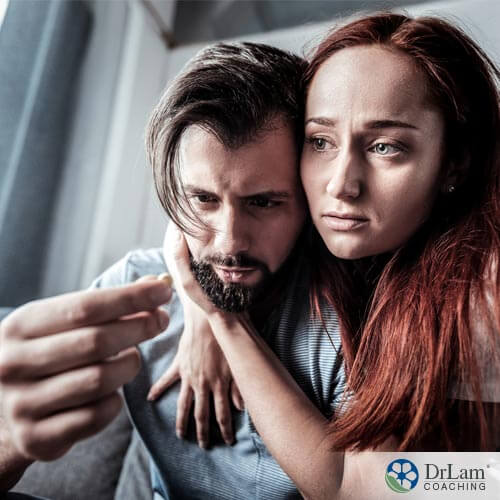 An image of  couple comforting each other while dealing with the effects of post finasteride syndrome