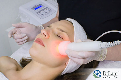 An image of a woman receiving red light therapy